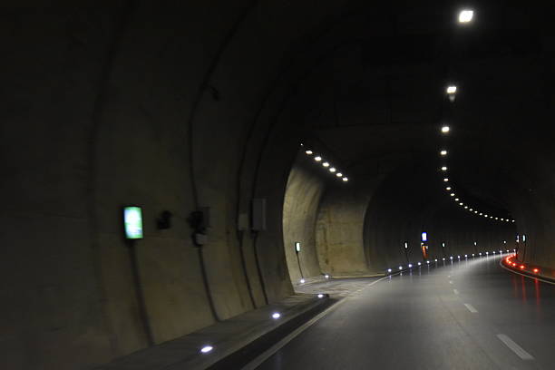 istock Evening tunnel lights and quiet road 2254459879