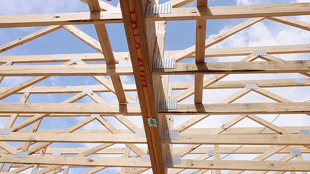 istock Construction of wooden frame building under works day 2254464396