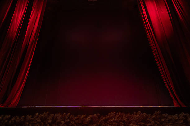 Empty Theater Stage with Red Velvet Curtains