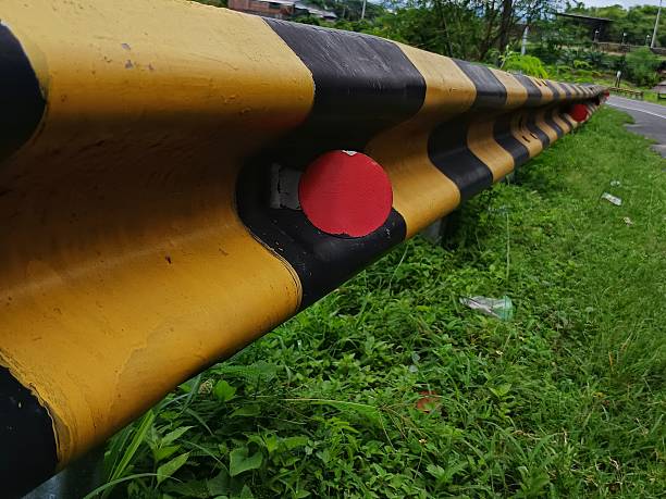 istock Yellow and black road barrier beside highway 2254466730