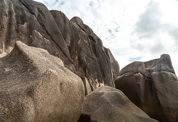 Famous granite rock formations with unique weathered shapes on the coast of La Digue Island Seychelles