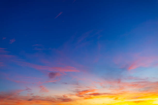 istock Vibrant sunset sky with colorful clouds and blue twilight gradient background, 2254469207