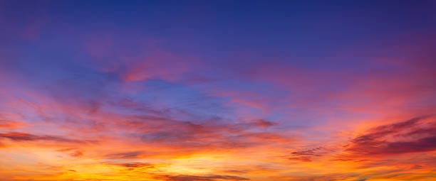 istock Vibrant sunset sky with colorful clouds and blue twilight gradient background, 2254469220