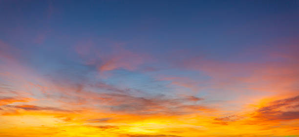 istock Vibrant sunset sky with colorful clouds and blue twilight gradient background, 2254469246