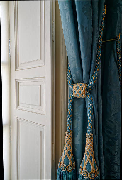 istock Curtain tiebacks with tassels and drapes. 2254469547