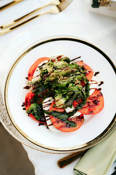 salad with tomatoes, arugula and sesame