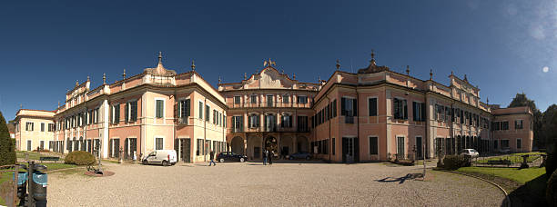 Varese, Lombardy, Italy: ornate Mannerist and Baroque 18th century belfry of the San Vittore basilica - known as Bernascone's bell tower, after its architect, Giuseppe Bernascone - Piazza Battistero.