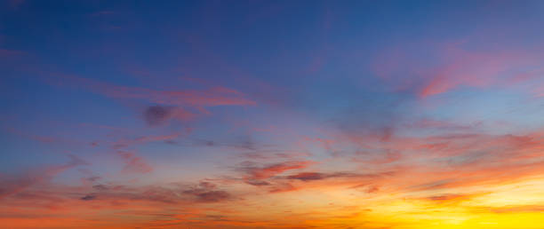 istock Vibrant sunset sky with colorful clouds and blue twilight gradient background, 2254476305