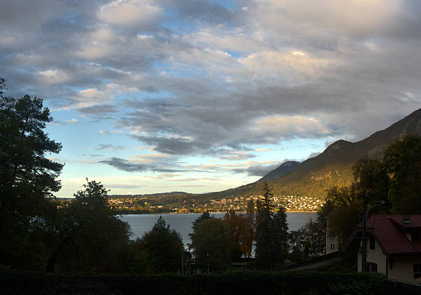 Autumn leaf colours and a sunset sky over the lake seen from a high viewpoint
