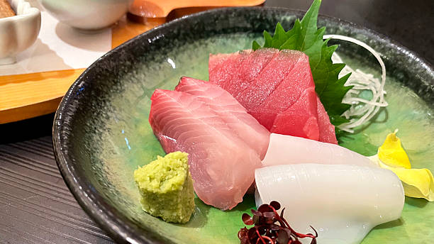 istock Fresh and delicious sashimi: tuna, yellowtail, squid 2254476494