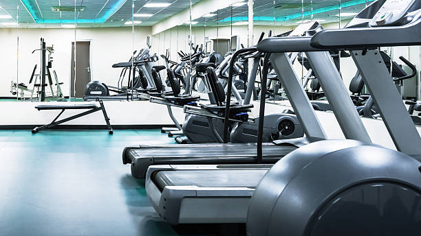 istock Fitness center with multiple treadmills and exercise equipment in clear view 2254476665