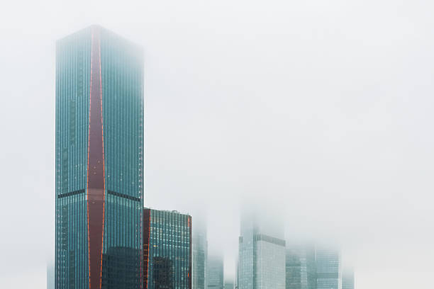 Tall buildings in the fog，Confused economic situation。