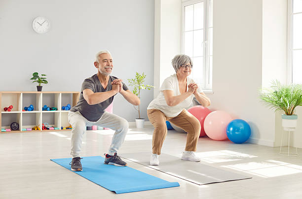 istock Active happy old senior doing squat morning exercise, sporty people practicing yoga lesson 2254477300