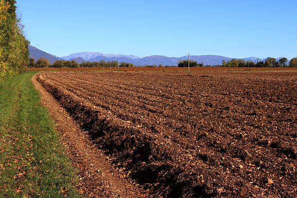 Freshly plowed field in the italian countryside on winter season