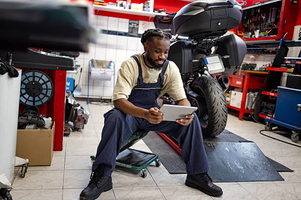 istock A mechanic sits in a workshop near a motorcycle 2254482137