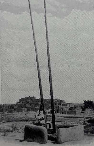 Antique illustration pre 1900 - man standing in a pueblo structure in New Mexico