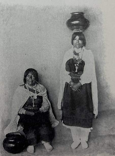 Antique illustration pre 1900 - two Indigenous North American women who live in a pueblo carrying water in large pots