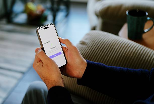istock Man Uses Gratitude App for Positive Outlook 2254494422