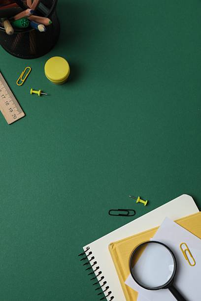 istock Flat lay with school stationery on green background, top view 2254495342