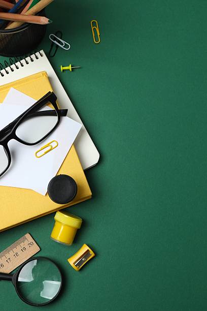 istock Flat lay with school stationery on green background, top view 2254495357