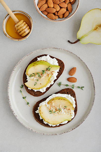 istock Bruschetta with cream cheese, honey, pear, thyme 2254496454