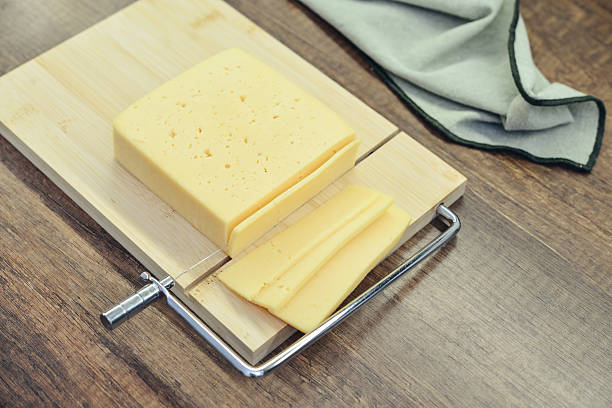 istock Bamboo cutting board with a built-in cheese cutting device 2254496629