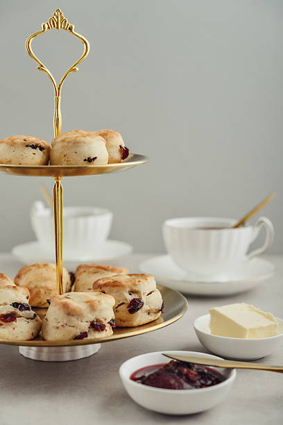 istock Golden two-tiered stand  with homemade scones 2254496702