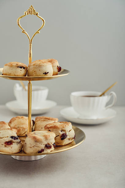 istock Golden two-tiered stand  with homemade scones 2254496712