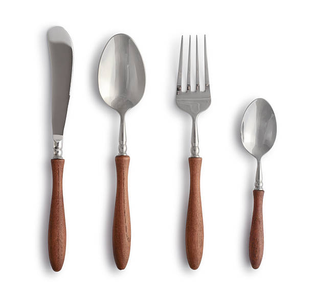istock Stylish cutlery set (butter knife, spoon, fork, teaspoon) with wooden handles 2254499817