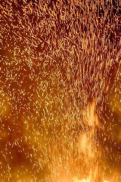 Element of fire, huge night fire on holiday, night fire. Dance sparks, Pyromania, Zoroastrianism, whirl of sparks, shower of sparks, ray of sparks, sparks fly upwards, red cock