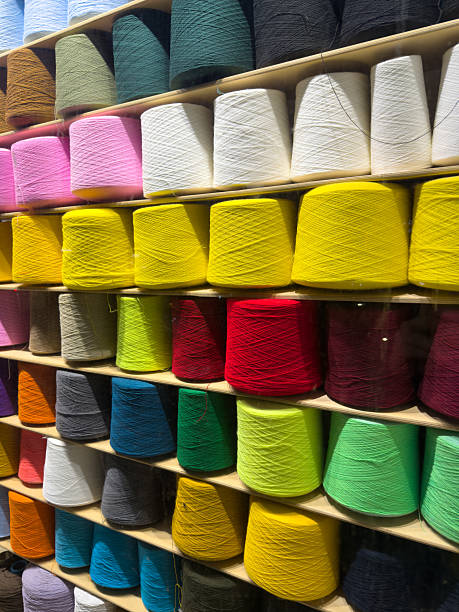 istock Colorful Spools Of Thread On Shelves In A Craft Store Display 2254500446