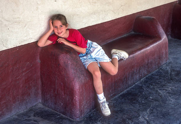 Albuquerque - Girl sprawls on a bench - 1990. Scanned from Kodachrome 64 slide.