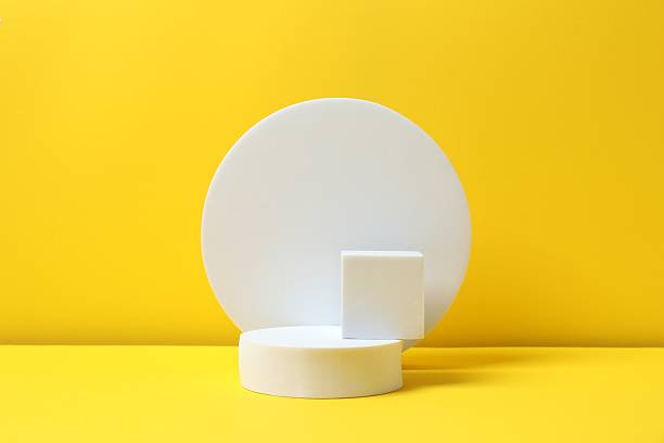 istock White podiums on a yellow background 2254502436