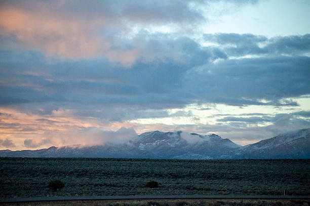 istock Desert Sunset Over Vast Landscape and Mountains 2254506064