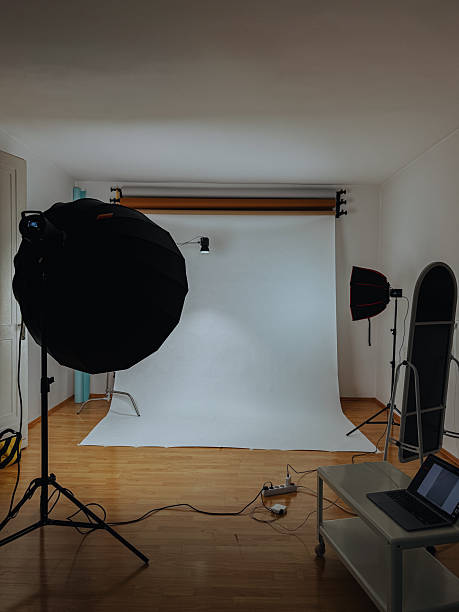istock Photography studio interior with lighting equipment and white backdrop 2254508244