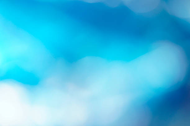 An abstract blue background design with bokeh effects that evoke the texture of water and the light of the deep ocean, blending waves of movement and natural brightness in an illustration of blurred art