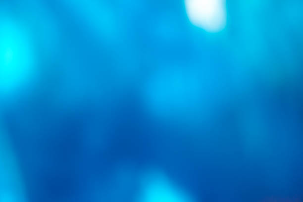 istock Abstract blue background with ocean light, vector art, soft bokeh waves, and shiny textures. 2254508687
