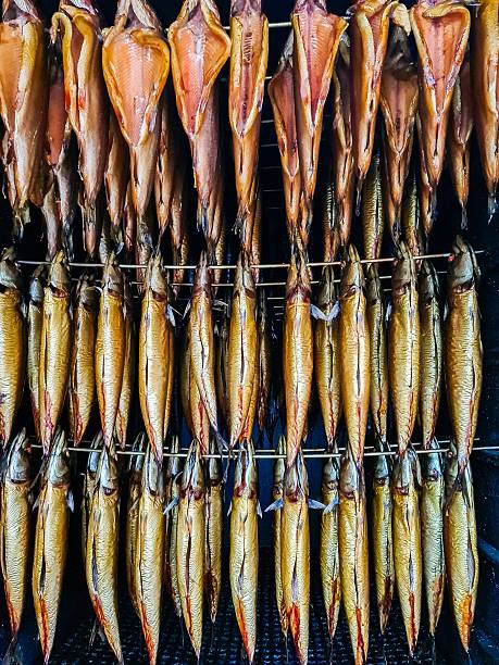istock Smoked fish hanging in a traditional smokehouse 2254511593
