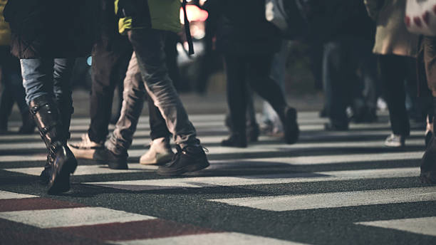 istock Crowd Of People Crossing Road 2254515517
