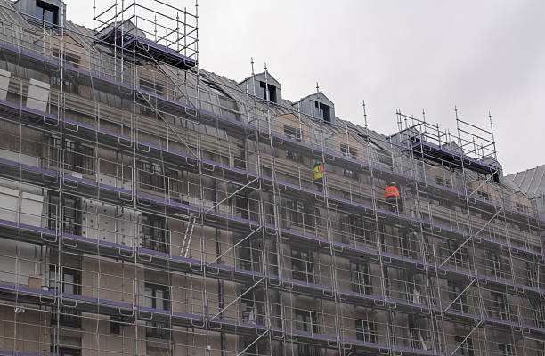 istock Building Renovation in Paris with Scaffolding and Safety Netting 2254519341