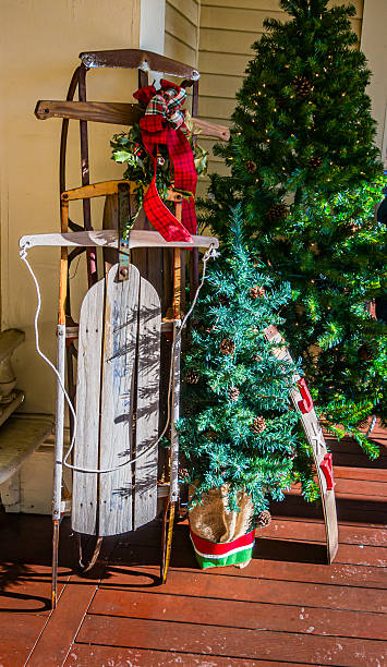 istock Old Sleds on the Porch 2254519381
