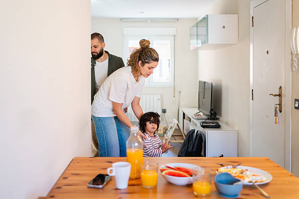istock Parents and their young child starting the day at home, getting ready for breakfast, creating family togetherness 2254520757