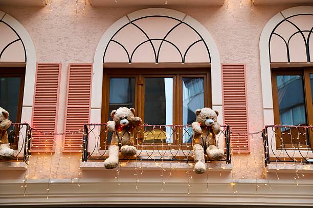 The toy bears placed in the building's window