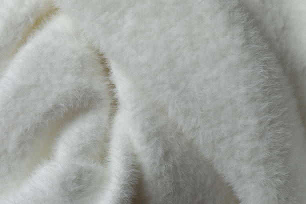 Knitted cozy warm blanket texture background with sunlight effect