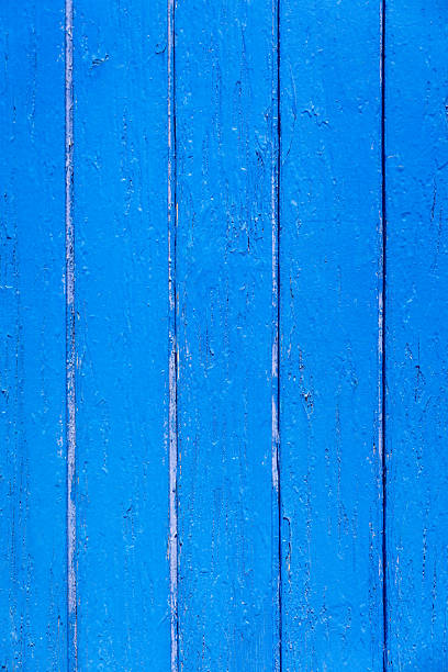 A macro image of blue planks painted a vibrant blue.