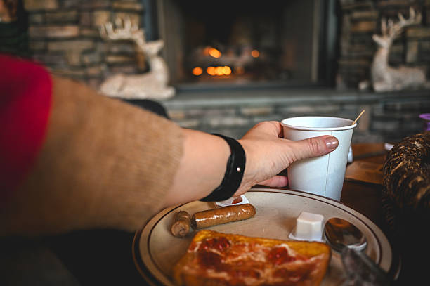 Enjoying breakfast and coffee by cozy fireplace