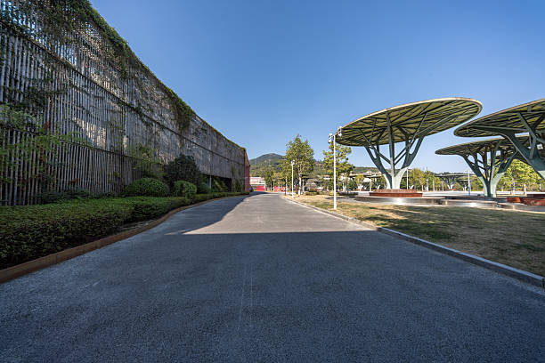 A road with green belts and modern urban architecture
