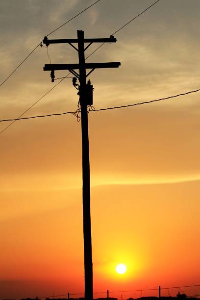 istock Blazing Kansas Sunset with a power line pole silhouette 2254551912