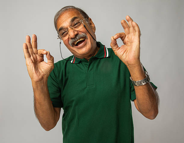istock Happy old man showing like sign on white background 2254558320
