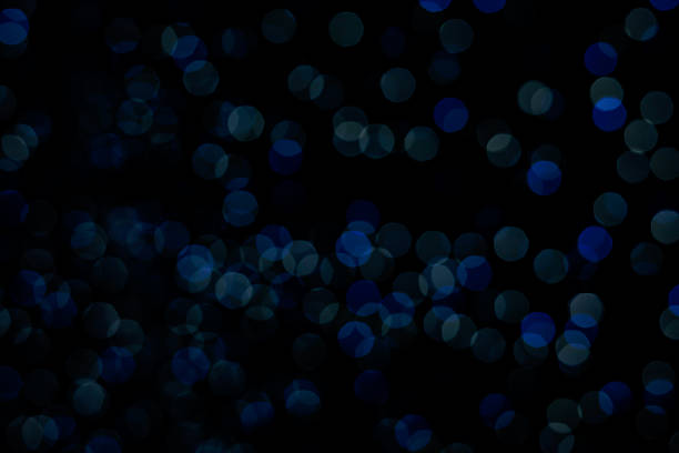 Beautiful abstract bokeh of soft twinkling lights in overlapping circles, suitable for graphic design and banners.